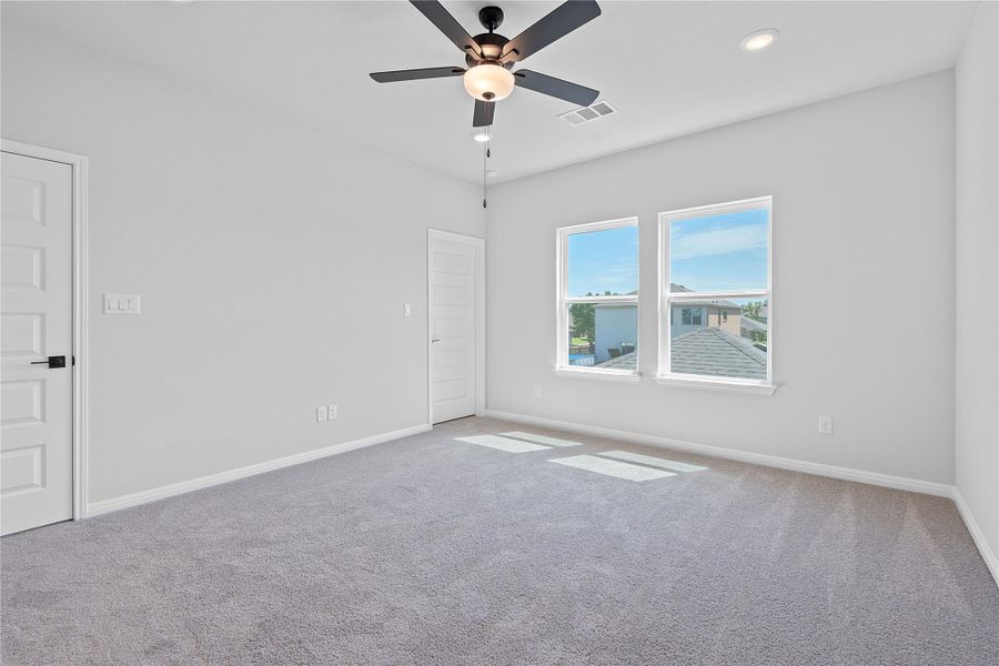 Empty room with carpet, a ceiling fan, and recessed lighting