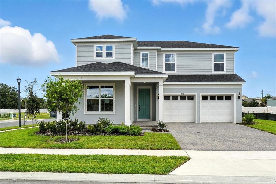 Front exterior of a new home in Winter Grove, Winter Garden, FL, highlighting curb appeal (Image 1).