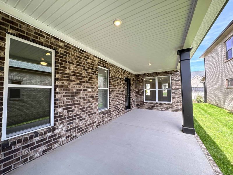 Exterior details and patio area of a home in The Paddock, Gallatin (Image 3).