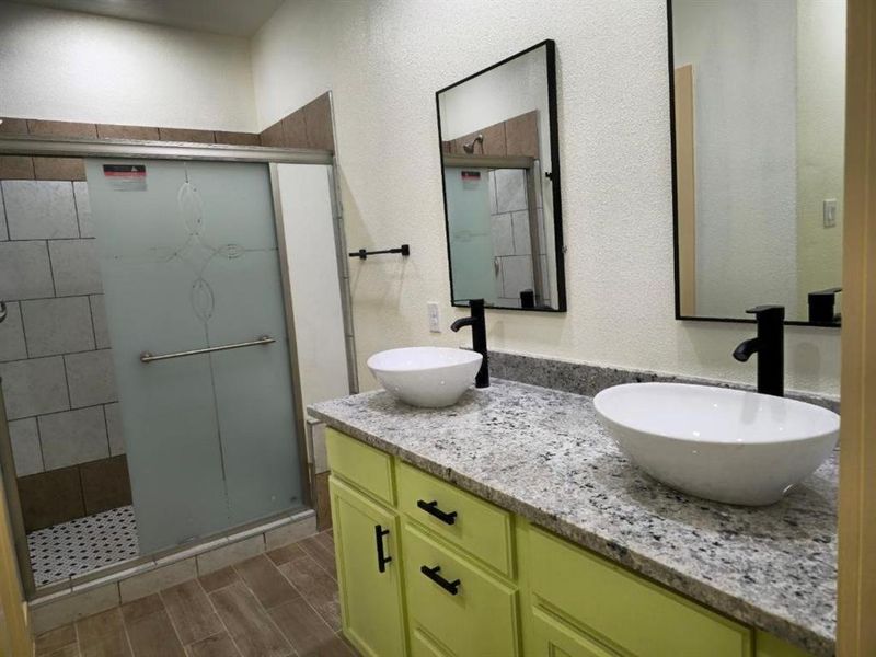 Bathroom with vanity and walk in shower