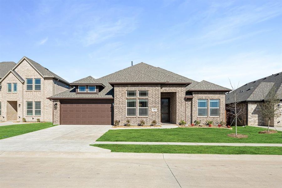 Front exterior of a new home in Timberbrook, Justin, TX, highlighting curb appeal (Image 24).