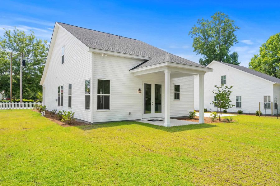 Exterior details and patio area of a home in Downtown Loris Homes, Loris (Image 26).