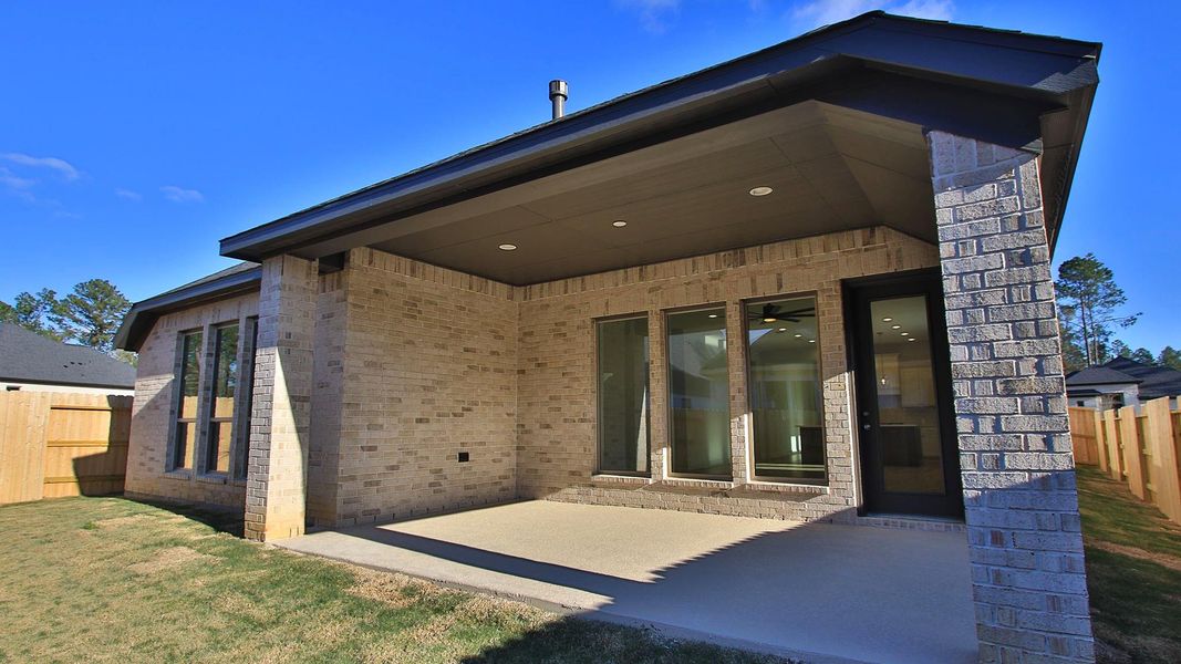 Exterior details and patio area of a home in Woodhavyn, Magnolia (Image 3).