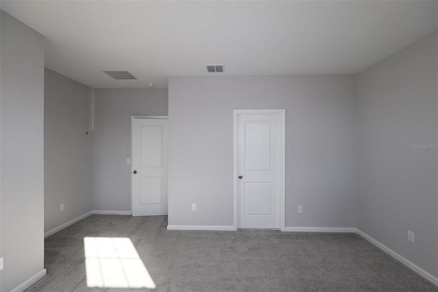 Spacious, unfurnished interior of a new home in Tribute at Ovation, Winter Garden (Image 7).