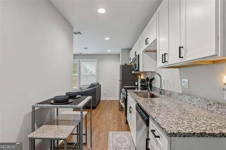 Furnished interior view inside a new home in , Atlanta (Image 4).