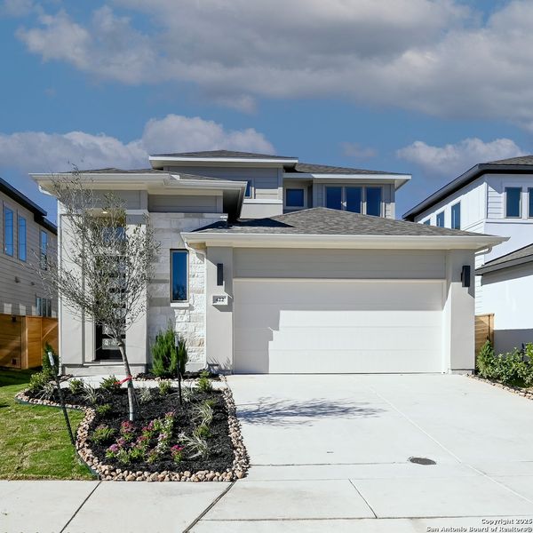 Front exterior of a new home in Solms Landing 45', New Braunfels, TX, highlighting curb appeal (Image 1).