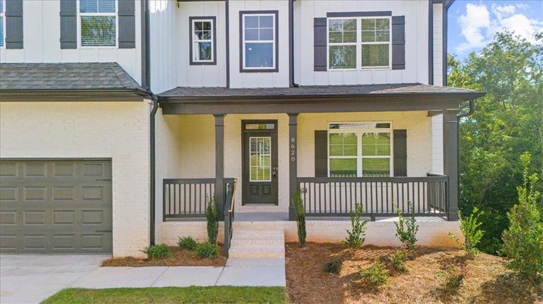 Front exterior of a new home in River Rock, Ball Ground, GA, highlighting curb appeal (Image 28).