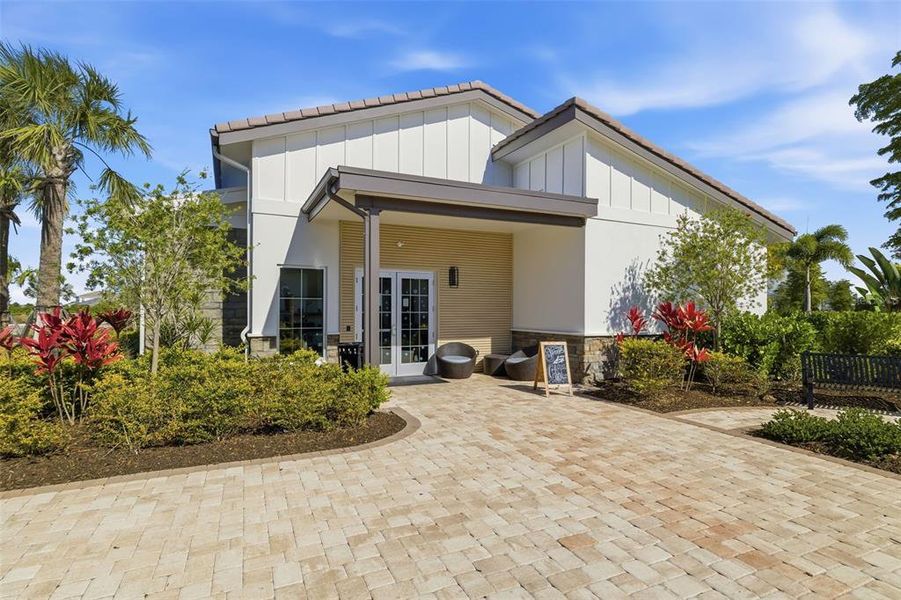 Front exterior of a new home in Star Farms at Lakewood Ranch, Bradenton, FL, highlighting curb appeal (Image 1). Front exterior of a new home in Star Farms at Lakewood Ranch, Bradenton, FL, highlighting curb appeal (Image 1).