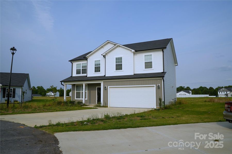 Front exterior of a new home in , Clayton, NC, highlighting curb appeal (Image 2).