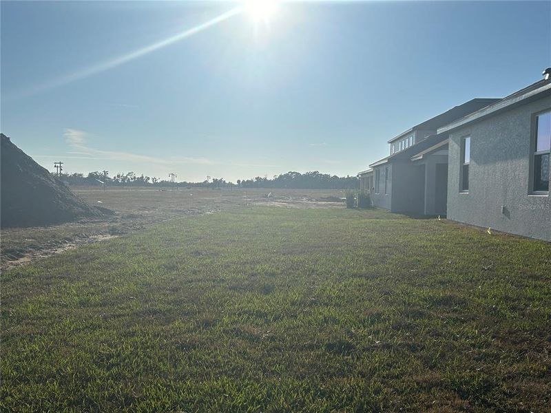 Exterior details and patio area of a home in Oakfield Trails Traditional, Parrish (Image 6).