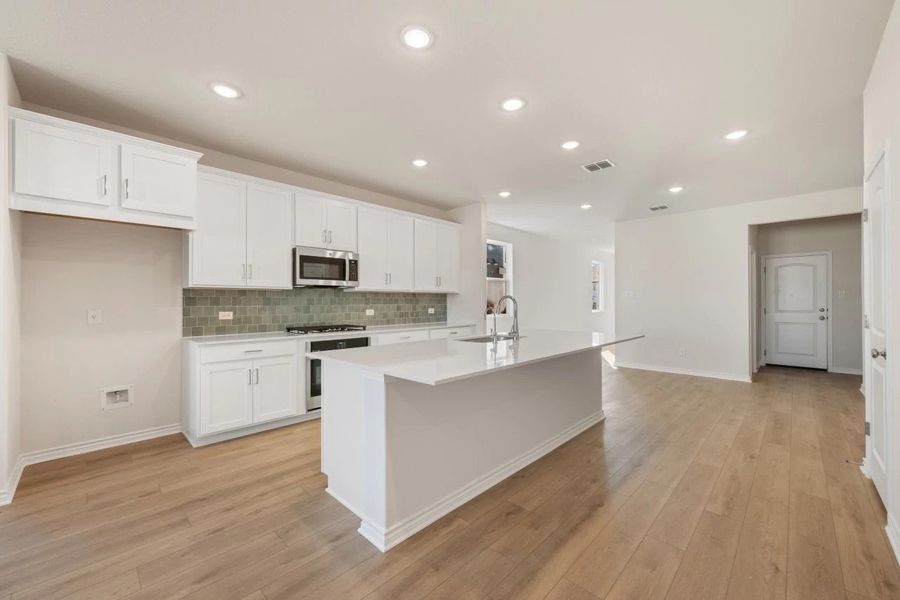 Furnished interior view inside a new home in Lariat, Liberty Hill (Image 8). Furnished interior view inside a new home in Lariat, Liberty Hill (Image 8).