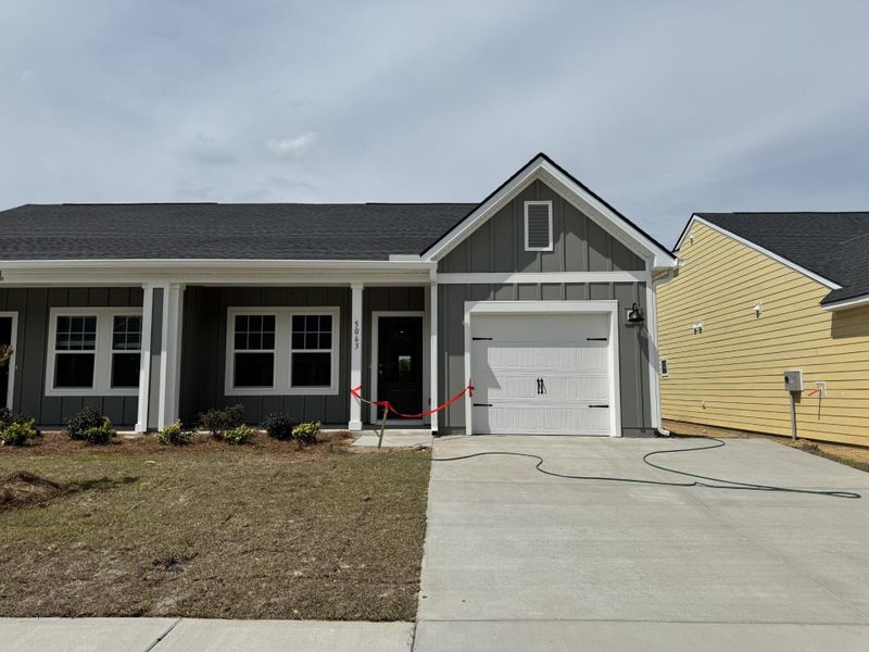 Front exterior of a new home in , Ravenel, SC, highlighting curb appeal (Image 16).