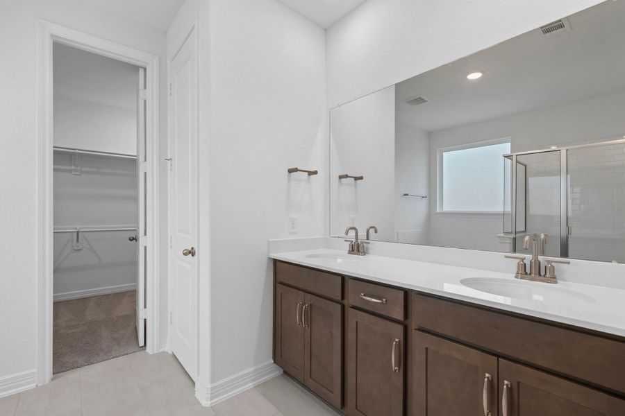 Primary bathroom. Sample product photo. Actual exterior and interior selections may vary by homesite. Photo may be virtually staged.