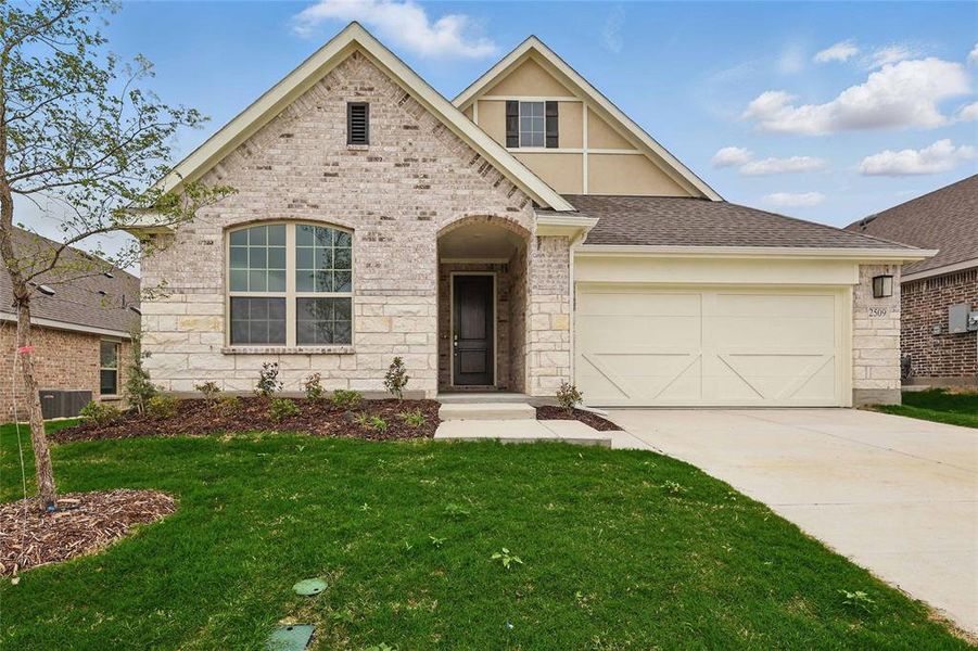 View of front of house with stone siding, a garage, a front yard, concrete driveway, and central air condition unit View of front of house with stone siding, a garage, a front yard, concrete driveway, and central air condition unit