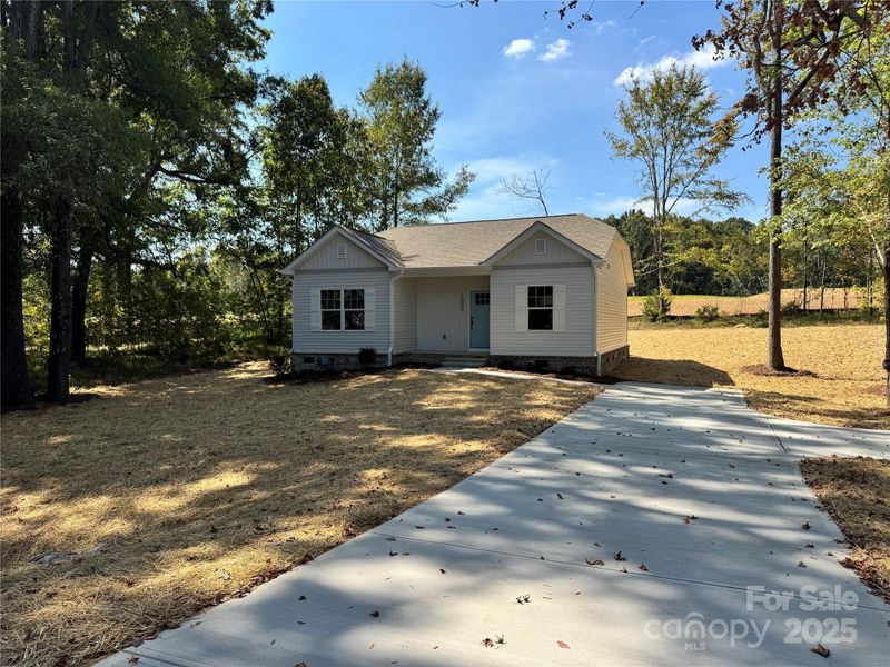 Front exterior of a new home in , Monroe, NC, highlighting curb appeal (Image 17).