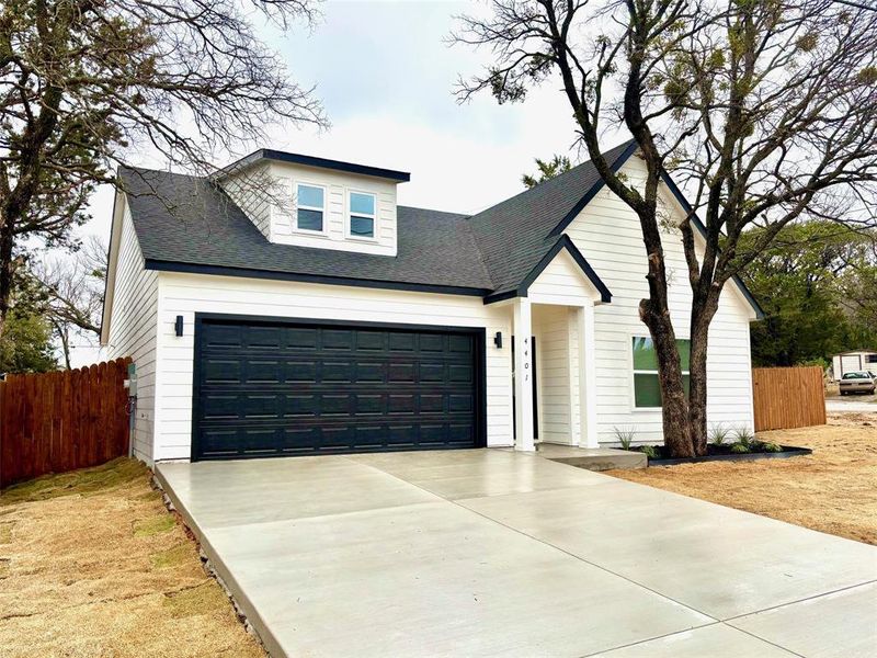 View of front facade featuring a garage