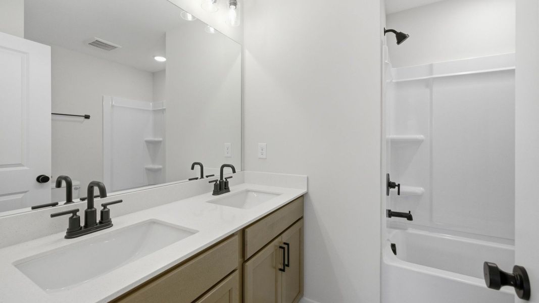 Secondary bathroom with dual vanity