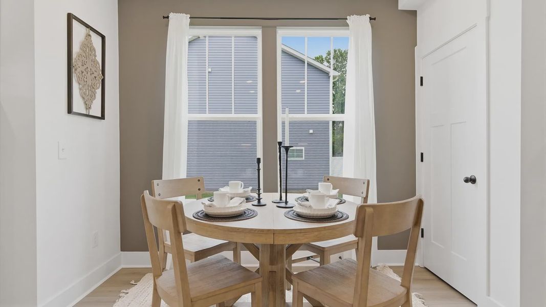 Inviting breakfast area with a seamless connection to the kitchen for everyday living at the Churchill Design