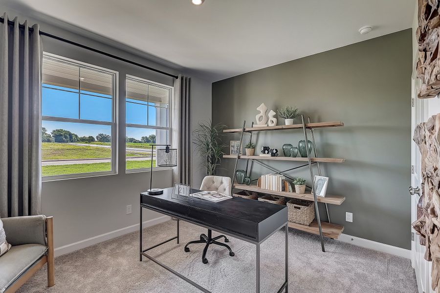 A room with a table and shelves.