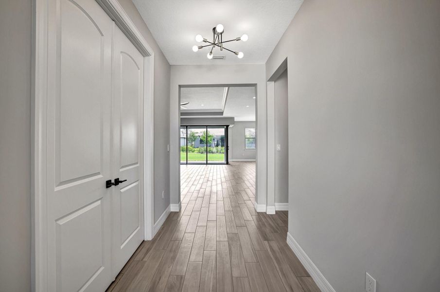 Foyer with Flex room to the left and Bedroom 2 to the right