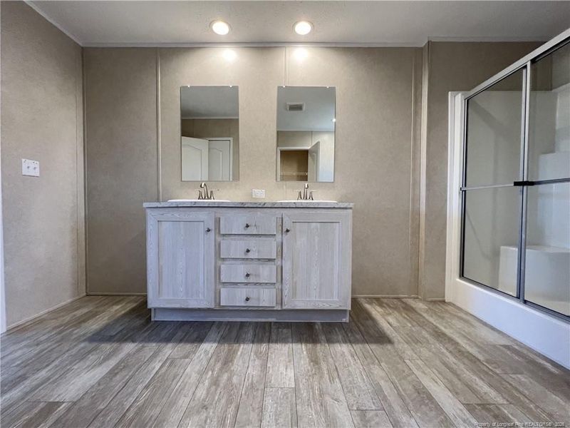 Primary bathroom view from closet