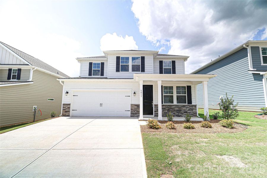 Front exterior of a new home in , Denver, NC, highlighting curb appeal (Image 17).