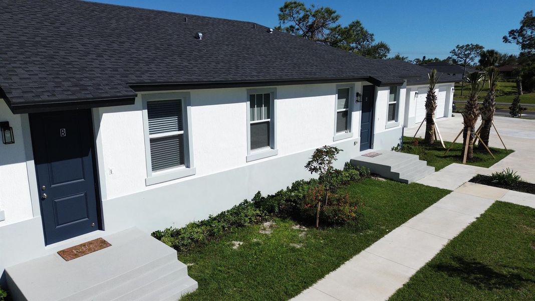 Front exterior of a new home in , Rotonda West, FL, highlighting curb appeal (Image 19).
