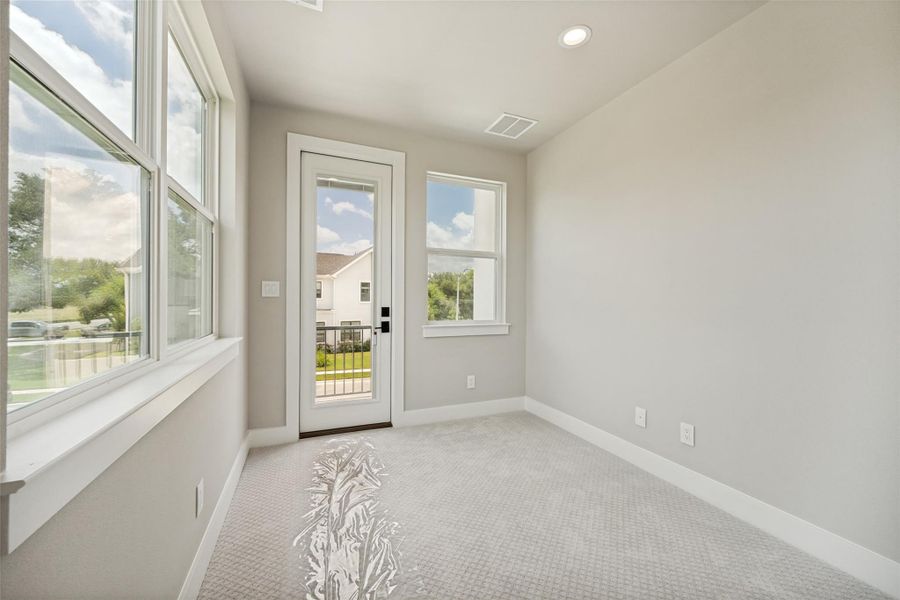 A quiet attached office to primary bedroom offering a private balcony, ideal for a tranquil escape. A quiet attached office to primary bedroom offering a private balcony, ideal for a tranquil escape.