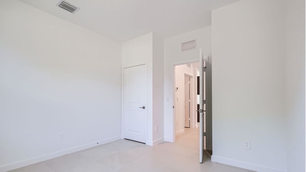Representative unfurnished interior of a home built from the Cali by D.R. Horton in Twin Oaks, Stuart (Image 22).