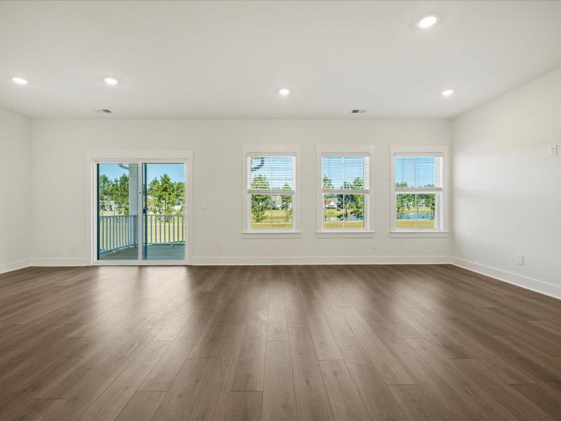 Spacious, unfurnished interior of a new home in The Coves at Lakes of Cane Bay, Summerville (Image 17).