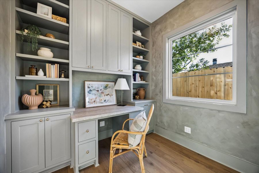Built in workspace featuring floor to ceiling cabinetry, open shelving, and integrated desk area with designer hardware and textured accent walls, offering a dedicated home office or study nook filled with natural light in this Harvard Homes design.**PREVIOUS BUILDER WORK** Built in workspace featuring floor to ceiling cabinetry, open shelving, and integrated desk area with designer hardware and textured accent walls, offering a dedicated home office or study nook filled with natural light in this Harvard Homes design.**PREVIOUS BUILDER WORK**
