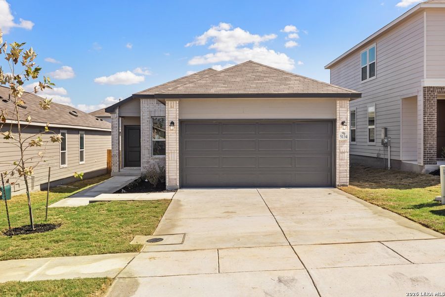 Front exterior of a new home in Knox Ridge, Converse, TX, highlighting curb appeal (Image 18).