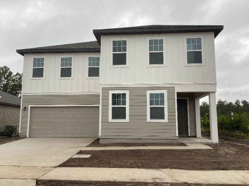 Exterior details and patio area of a home in Ellington Traditional, St. Cloud (Image 2).
