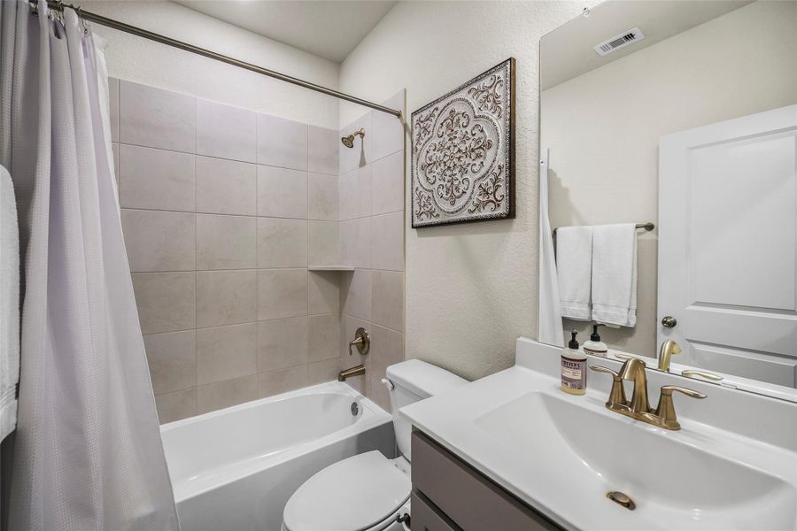 Furnished interior view inside a new home in The Highlands - Grove Collection, Porter (Image 14).