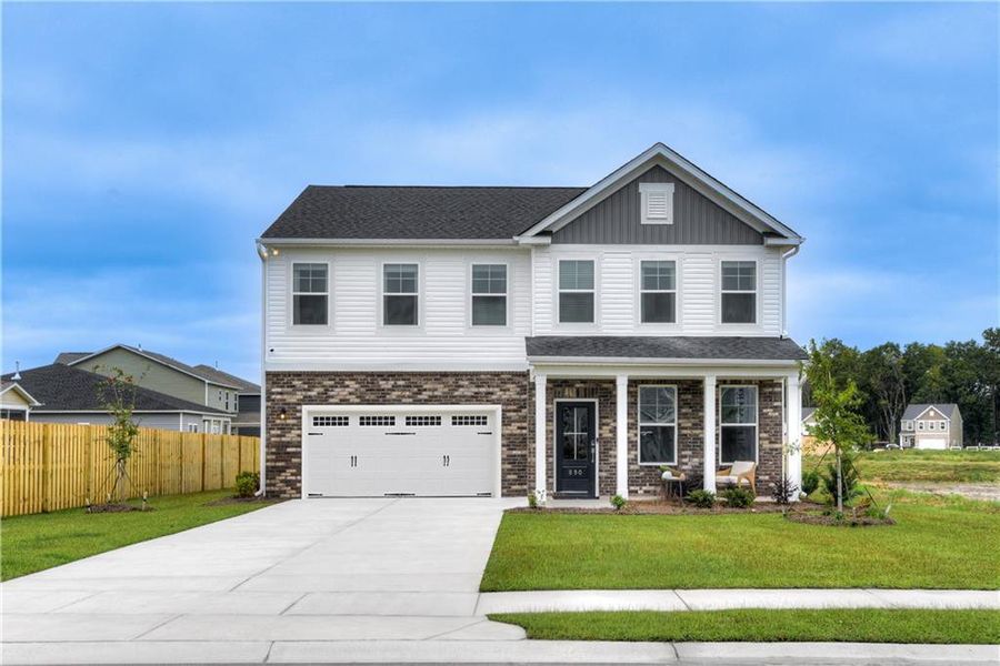 Front exterior of a new home in River Oaks, Locust Grove, GA, highlighting curb appeal (Image 21). Front exterior of a new home in River Oaks, Locust Grove, GA, highlighting curb appeal (Image 21).