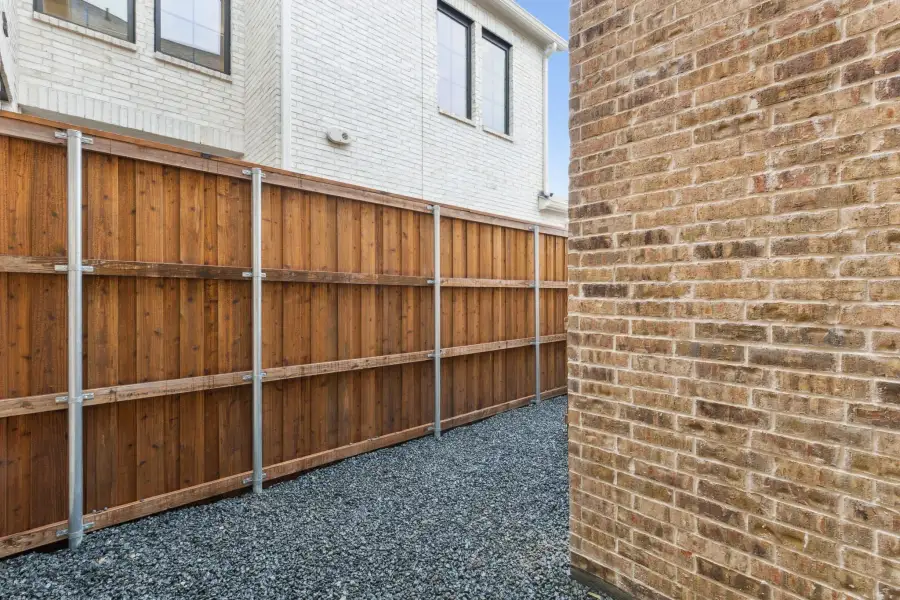 Exterior details and patio area of a home in Newman Village Townhomes, Frisco (Image 27).