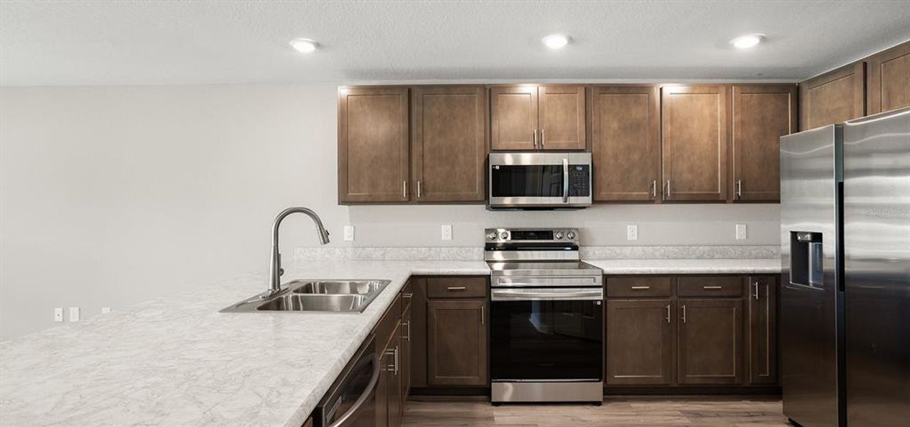 Furnished interior view inside a new home in Harbor at Lake Henry - Townhomes, Winter Haven (Image 5).