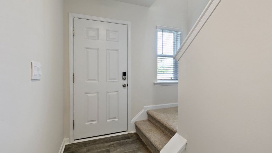 Furnished interior view inside a new home in Edinborough Townes, Gibsonville (Image 2).