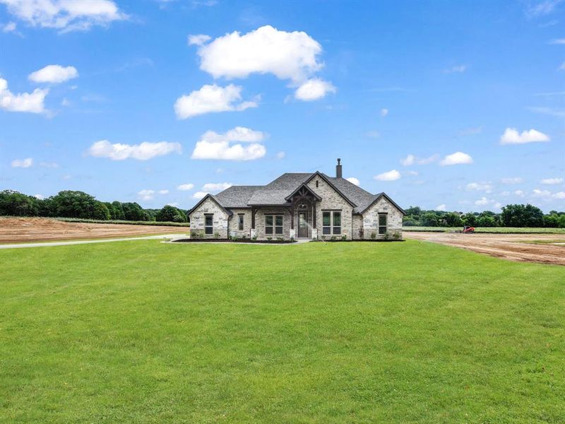 Front exterior of a new home in , Azle, TX, highlighting curb appeal (Image 18). Front exterior of a new home in , Azle, TX, highlighting curb appeal (Image 18).