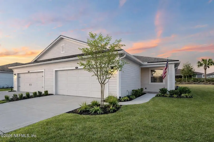 Front exterior of a new home in , St. Johns, FL, highlighting curb appeal (Image 1). Front exterior of a new home in , St. Johns, FL, highlighting curb appeal (Image 1).