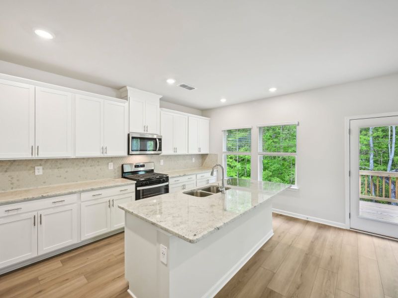 Furnished interior view inside a new home in Martin Springs - Estate Series, Lawrenceville (Image 7).