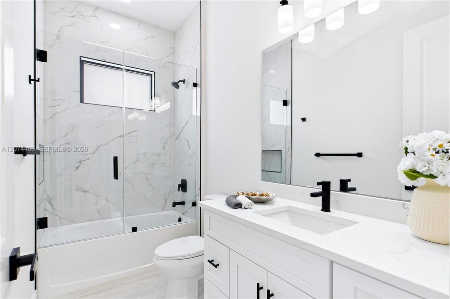 STYLISH HALL BATHROOM makes everyday routines effortless w/ a bright modern design, QUARTZ vanity & beautifully tiled TUB/SHOWER. Perfectly positioned for FAMILY & GUESTS while maintaining the home’s cohesive CONTEMPORARY STYLE! STYLISH HALL BATHROOM makes everyday routines effortless w/ a bright modern design, QUARTZ vanity & beautifully tiled TUB/SHOWER. Perfectly positioned for FAMILY & GUESTS while maintaining the home’s cohesive CONTEMPORARY STYLE!