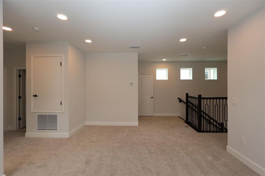 Spacious, unfurnished interior of a new home in Lake Star at Ovation, Winter Garden (Image 20).