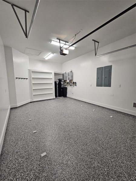 This home features sleek epoxy floors, a water softener with reverse osmosis, and dual tankless water heaters for modern convenience and efficiency. This home features sleek epoxy floors, a water softener with reverse osmosis, and dual tankless water heaters for modern convenience and efficiency.