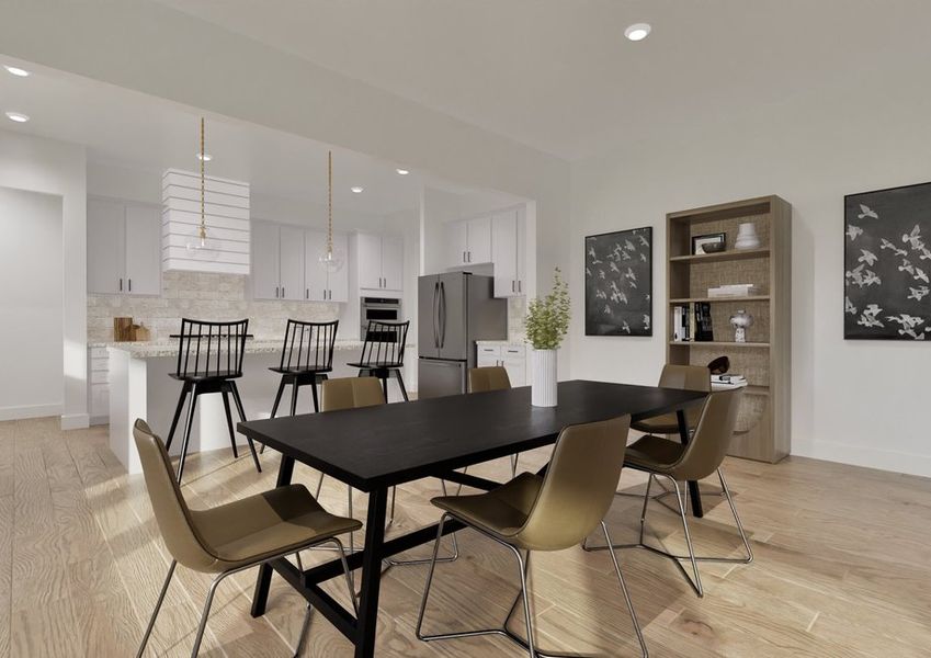 Modern dining room and kitchen with light floors, a black table, brown chairs, and black bar stools. Art and a bookshelf add elegance. Bright and airy. Modern dining room and kitchen with light floors, a black table, brown chairs, and black bar stools. Art and a bookshelf add elegance. Bright and airy.