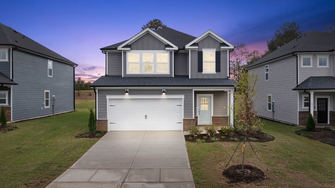 Front exterior of a new home in Providence Oaks, Fuquay Varina, NC, highlighting curb appeal (Image 16). Front exterior of a new home in Providence Oaks, Fuquay Varina, NC, highlighting curb appeal (Image 16).