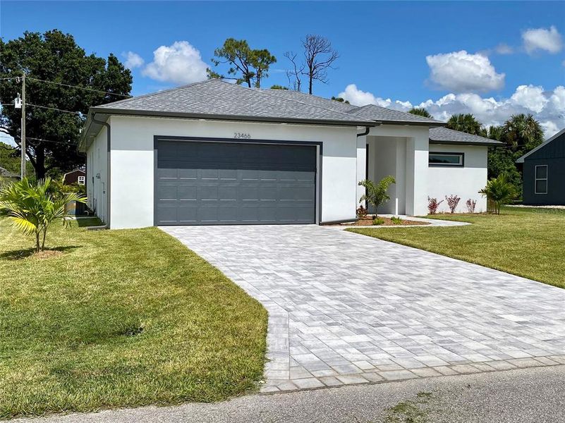 Front exterior of a new home in , Port Charlotte, FL, highlighting curb appeal (Image 26).