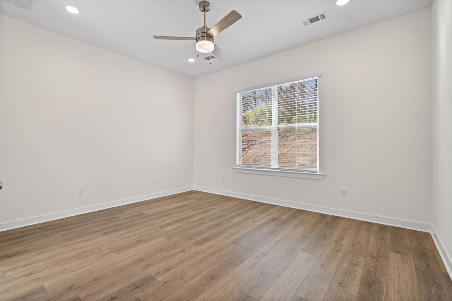 Empty room with recessed lighting, ceiling fan, and wood finished floors
