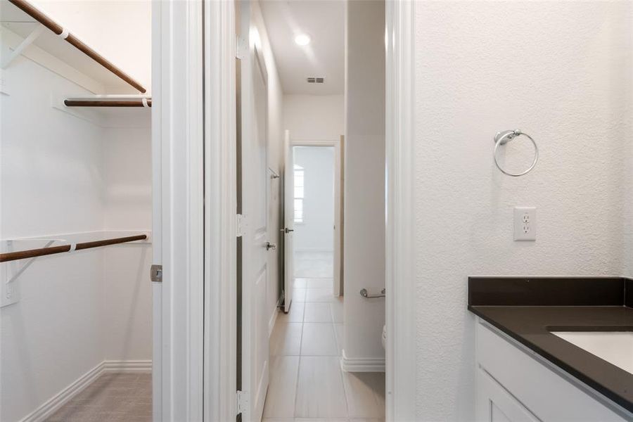 Bathroom featuring tile patterned floors and vanity