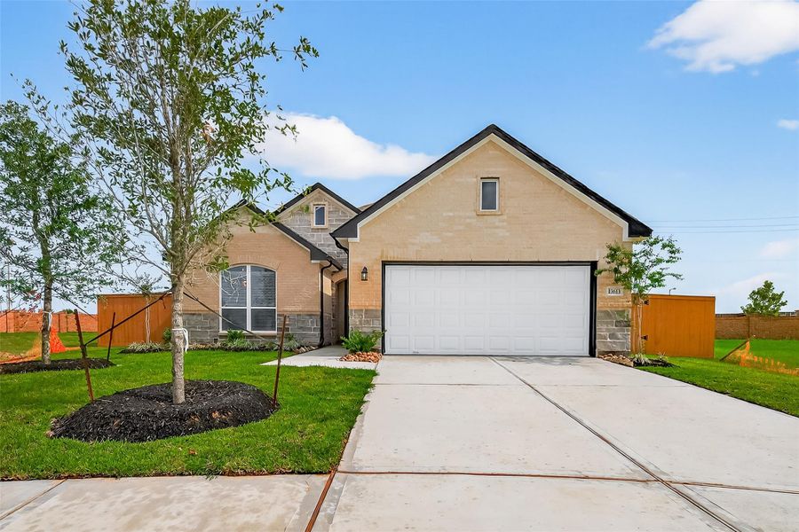 Front exterior of a new home in Lago Mar, La Marque, TX, highlighting curb appeal (Image 20).